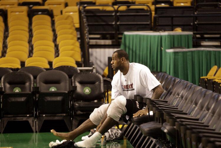 Miami Heat forward LeBron James ices his knees at the end of a team shoot around.
