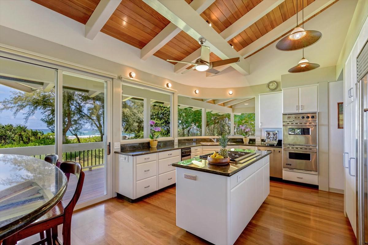The kitchen has a center island and an ocean view.