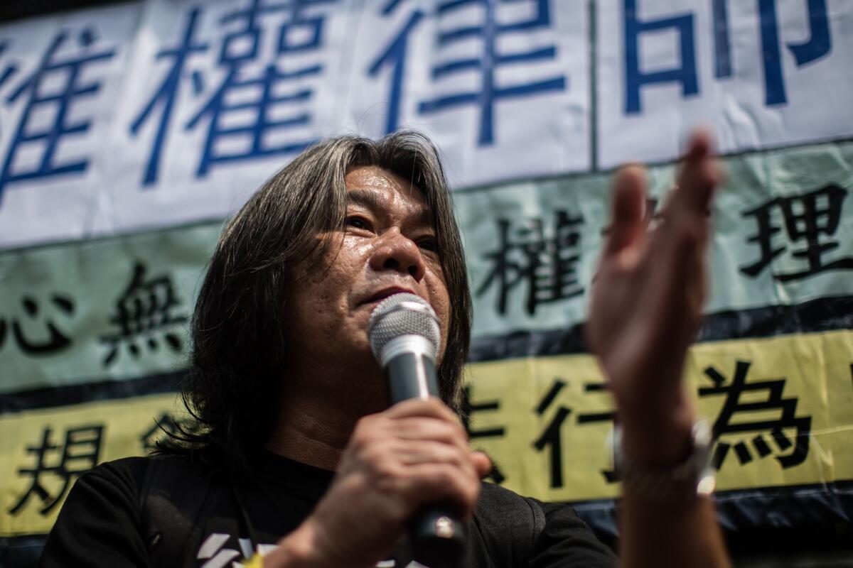 Hong Kong legislator Leung Kwok-hung of the League of Social Democrats speaks during a July 12 protest in Hong Kong after dozens of Chinese human rights lawyers and activists were detained or questioned in a police sweep.