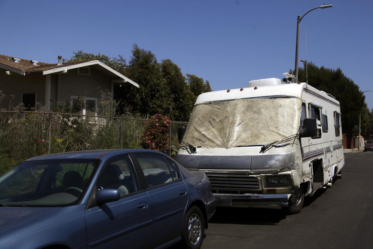 Los Angeles is considering ways to limit people sleeping in vehicles on city streets. Above, a homeless man's RV in Venice in 2014.
