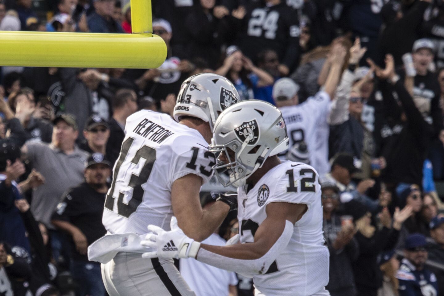 Oakland Raiders wide receiver Hunter Renfrow, left, celebrates with teammate Zay Jones after scoring a touchdown.