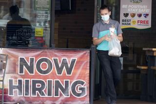 FILE - In this Sept. 2, 2020 file photo, a customer wears a face mask as they carry their order past a now hiring sign at an eatery in Richardson, Texas. On Thursday, Nov. 5, the number of Americans seeking unemployment benefits fell slightly last week to 751,000, a still-historically high level that shows that many employers keep cutting jobs in the face of the accelerating pandemic. (AP Photo/LM Otero, File)