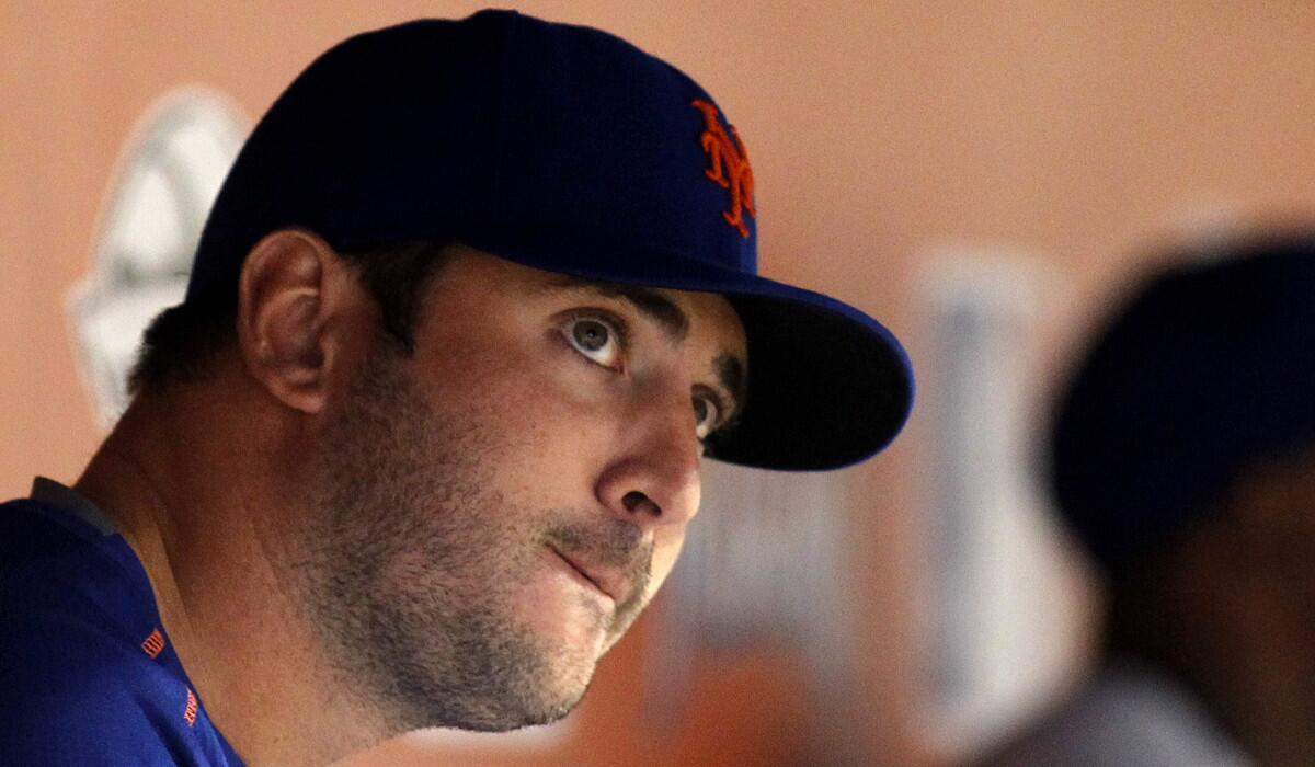 New York Mets pitcher Matt Harvey watches play from the dugout during a game against the Miami Marlins on Saturday.