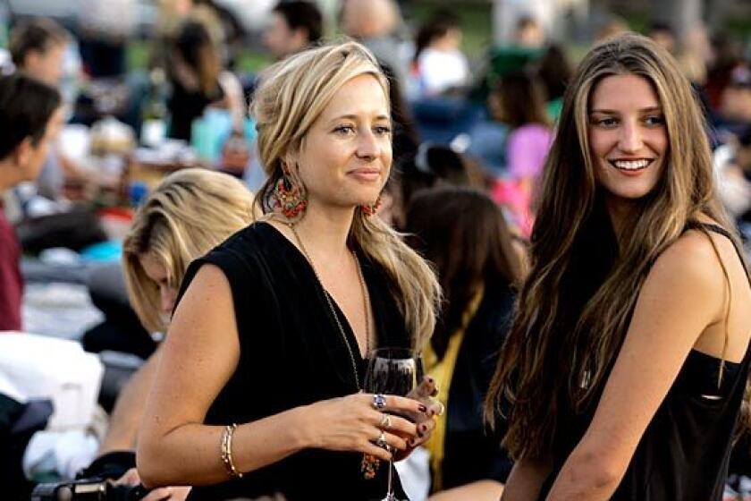 London socialite Tamsin Lonsdale, left, chats with Michele Ouellet. Lonsdale runs Supper Club.