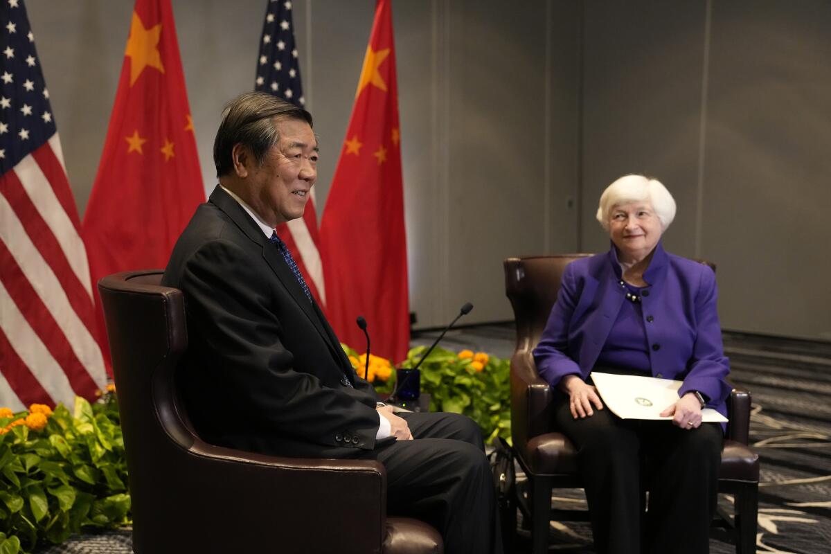 Treasury Secretary Janet Yellen, right, sits next to Chinese Vice Premier He Lifeng Friday