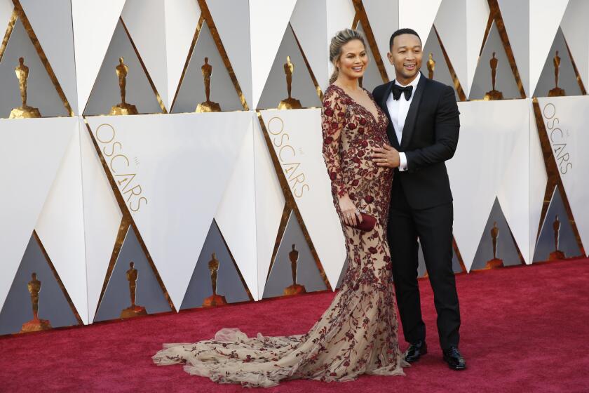 John Legend & Chrissy Teigen during the arrivals at the 88th Academy Awards.