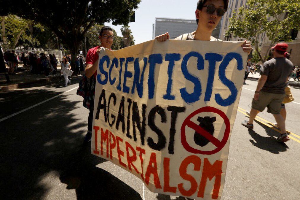 Art Li, right, and Mario Rojas make their statement known at the L.A. March for Science.