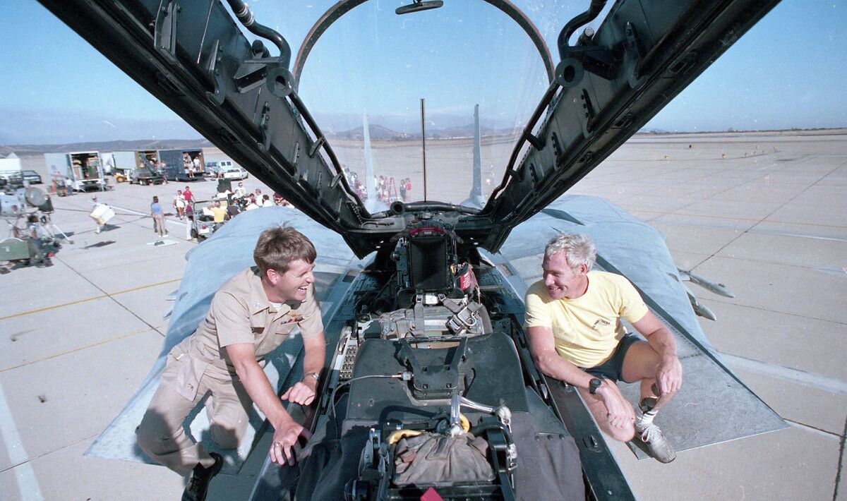 John Semcken, left, and Pete Pettigrew on a jet at Miramar Naval Air Station, on July 27, 1985. Paramount was filming of the movie, "Top Gun" (Photo by Charles Starr/San Diego Union-Tribune) User Upload Caption: U-T file photos of pilots and planes at Miramar Naval Air Station during the filming of Paramount Pictures "Top Gun" movie in the summer of 1985.