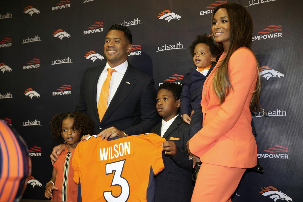 Russell Wilson brought his family along to introductory news conference in Denver.