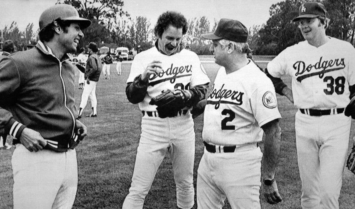 Jay Johnstone, left, laughs with teammates Don Stanhouse and Dave Goltz along with manager Tommy Lasorda in 1980. 