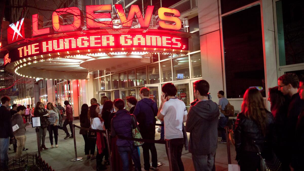 Fans line up outside the 34th Street Loews AMC Theatre in New York.