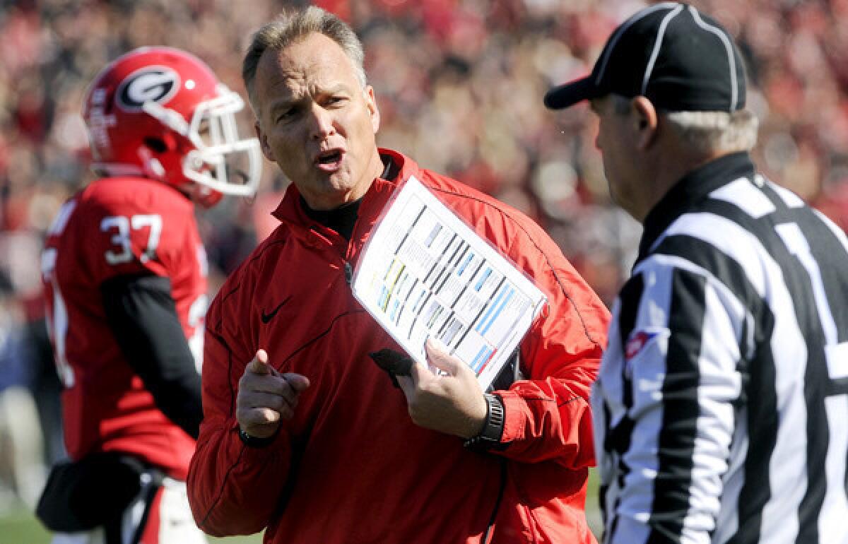 Georgia Coach Mark Richt argues a call with an official during a 42-10 victory over Georgia Tech on Saturday.