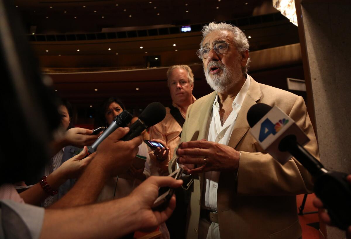 Placido Domingo talks to members of the press at the Dorothy Chandler Pavilion in 2013.