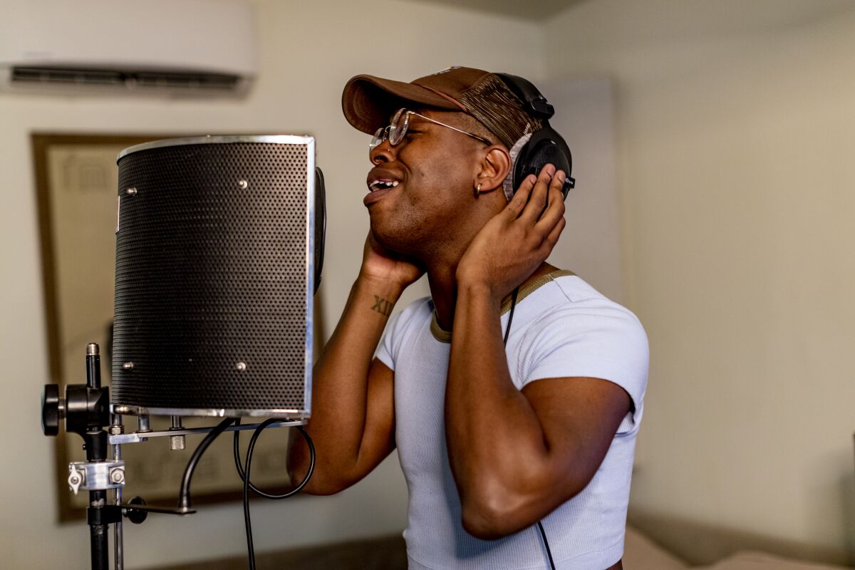 Singer Kelechi Kalu of West Hollywood rehearses his music in a back house rehearsal space.