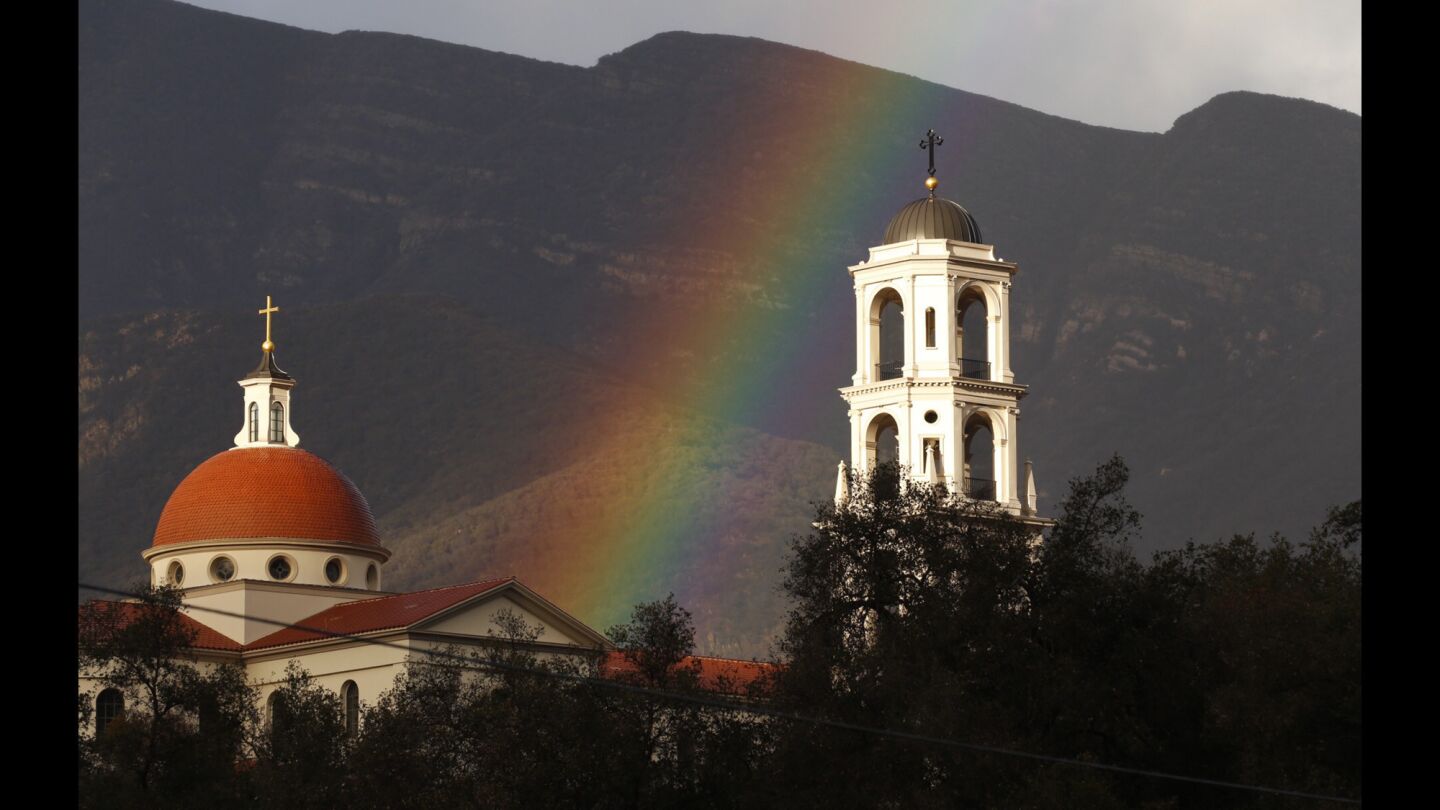 A rainbow fills the sky above the Thomas Aquinas College in the Topatopa Mountains near Santa Paula Thursday afternoon.