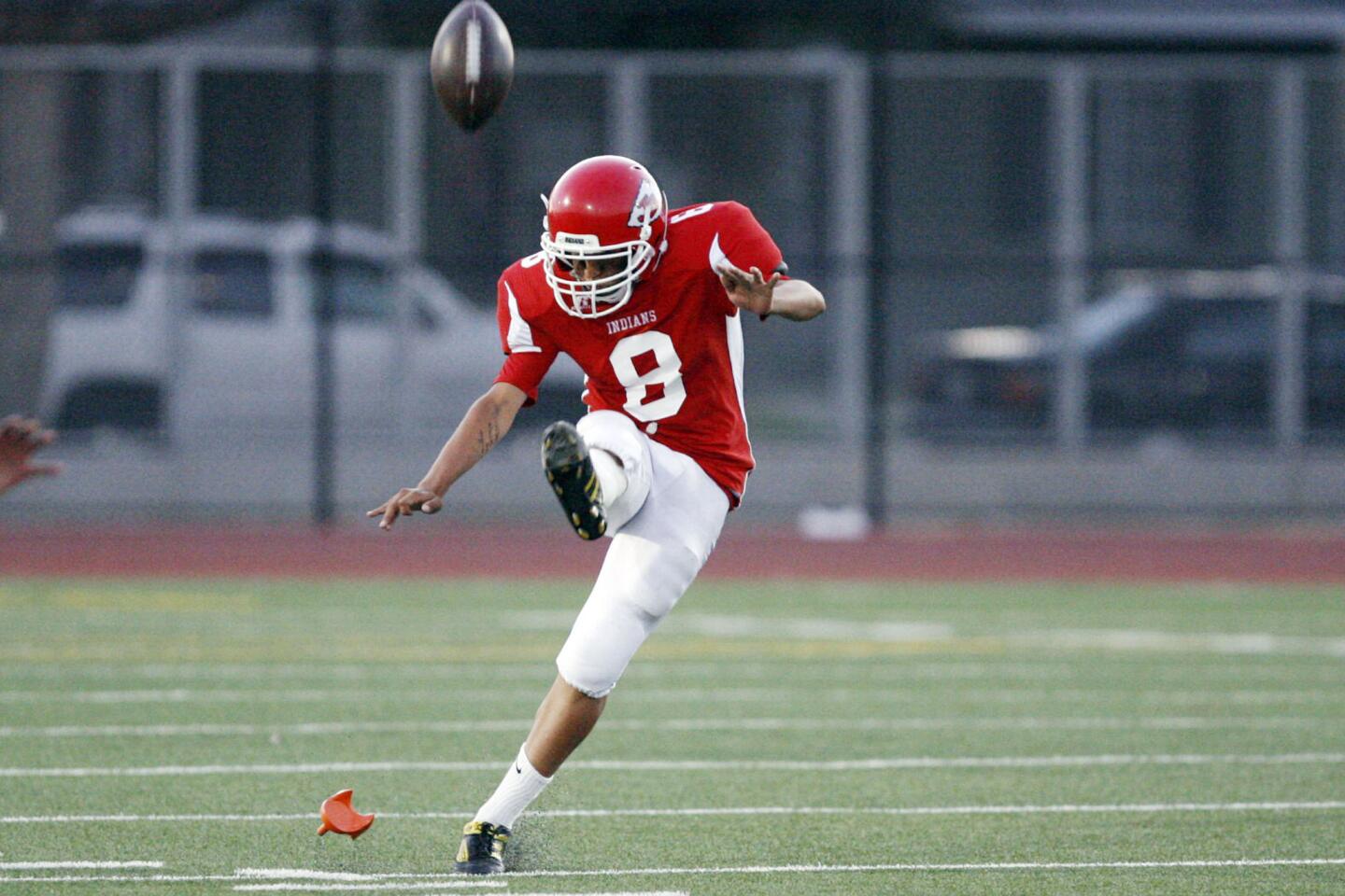 Burroughs' Jairo Gomez kicks off the ball during a game against North Hollywood at John Burroughs High School in Burbank on Friday, September 7, 2012.