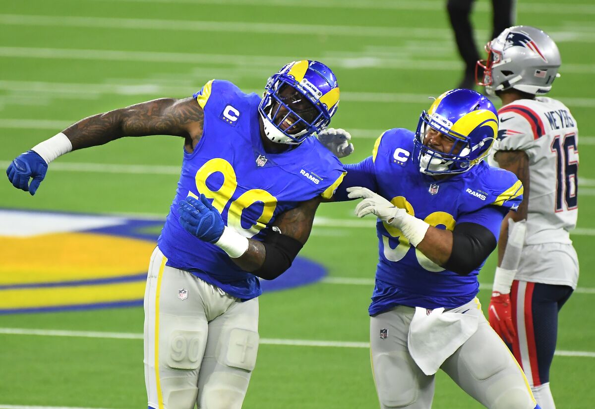 Rams defensive lineman Michael Brockers, left, celebrates his sack of Patriots quarterback Cam Newton with Aaron Donald.