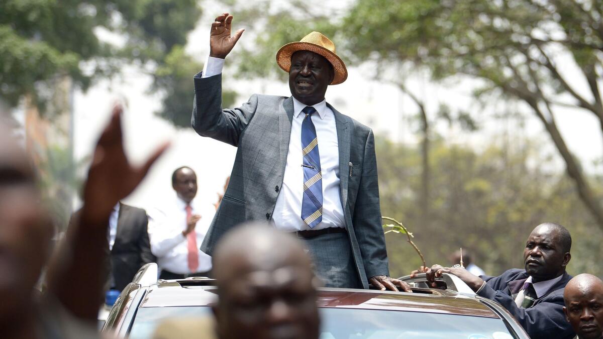 Kenyan opposition leader Raila Odinga waving to supporters as he leaves the Supreme Court Sept. 1, 2017, in Nairobi.