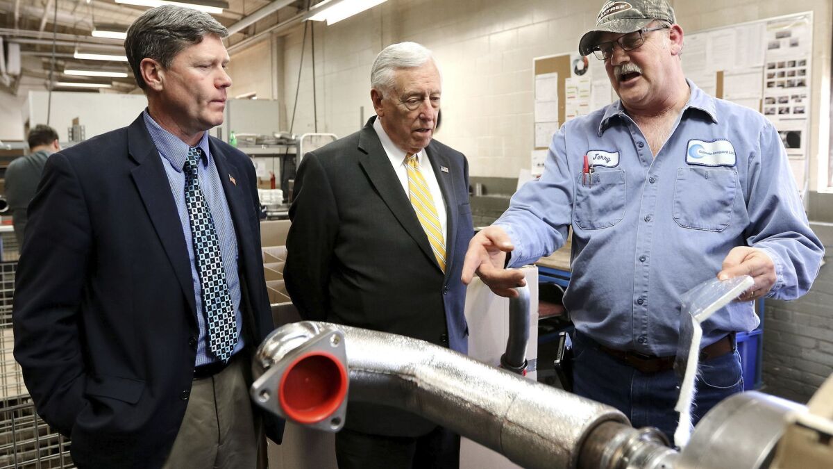Jerry Olson, right, of Culimeta-Saveguard in Eau Claire, Wis., gives a tour to Rep. Ron Kind (D-Wis.), left, and House Minority Whip Steny Hoyer (D-Md.) on April 5, 2018.