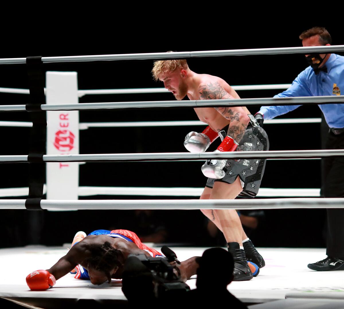 LOS ANGELES, CALIFORNIA - NOVEMBER 28: Jake Paul reacts over his knockout victory against Nate Robinson.