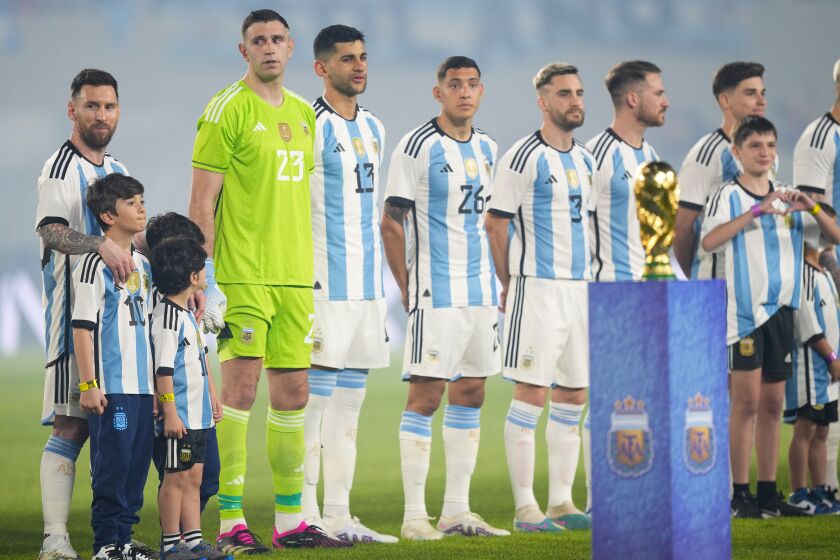 Argentina's Lionel Messi and teammates line up prior to an international friendly soccer match against Panama in Buenos Aires, Argentina, Thursday, March 23, 2023. (AP Photo/Natacha Pisarenko)