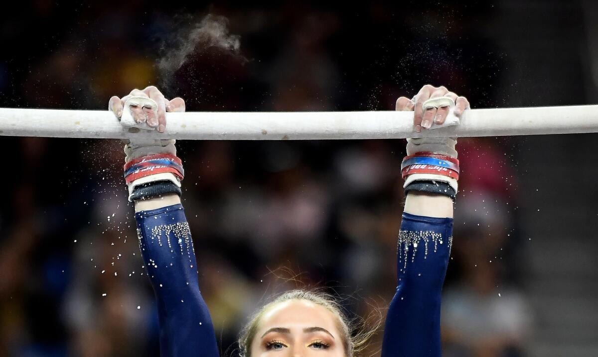 UCLA's Norah Flatley competes on the uneven bars during a meet at Pauley Pavilion.