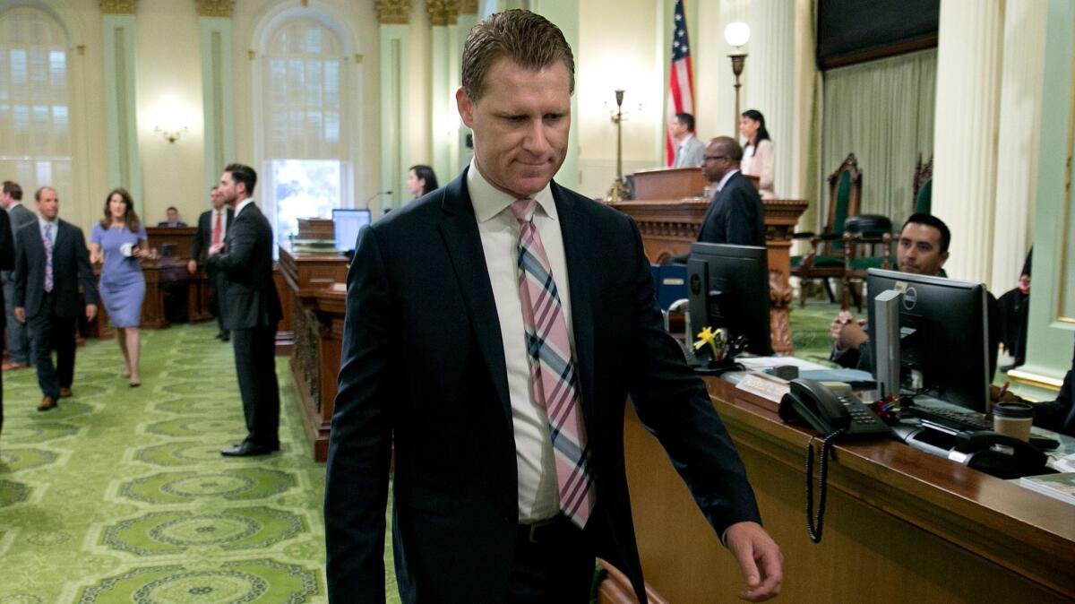 Chad Mayes of Yucca Valley leaves the Assembly floor before resigning as Assembly Republican leader on Aug. 24.