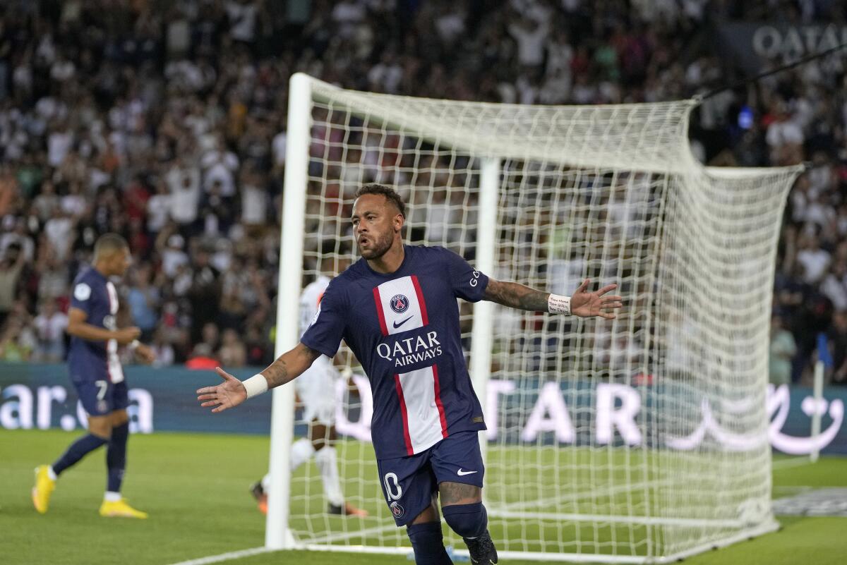 PSG's Neymar celebrates after scoring his side's third goal during the French League One soccer match between Paris Saint-Germain and Montpellier at the Parc des Princes in Paris, Saturday, Aug. 13, 2022. (AP Photo/Francois Mori)