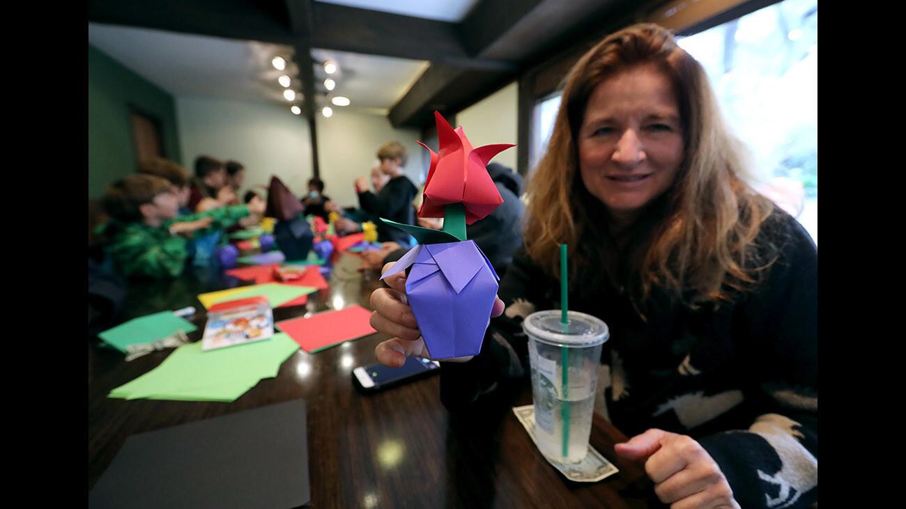 Lisa Lashaway of Montrose shows off her finished Origami Thai tulip she made during the Descanso Gardens Origami Hands-On Demonstration, led by instructor Michael Sanders, at the La Cañada Flintridge landmark on Saturday, March 3, 2018. There were two sessions where about 30 people learned how to make two origami items, including the Thai tulip and a children’s spinner. Participants ranged in age from young children to older adults. All materials for the origami were provided to the attendees.