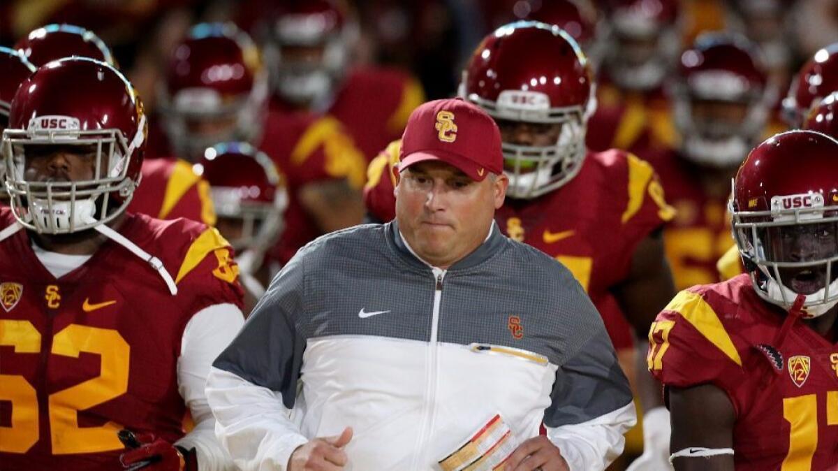 USC Coach Clay Helton leads his Trojans out of the tunnel before a game against California on Oct. 27.