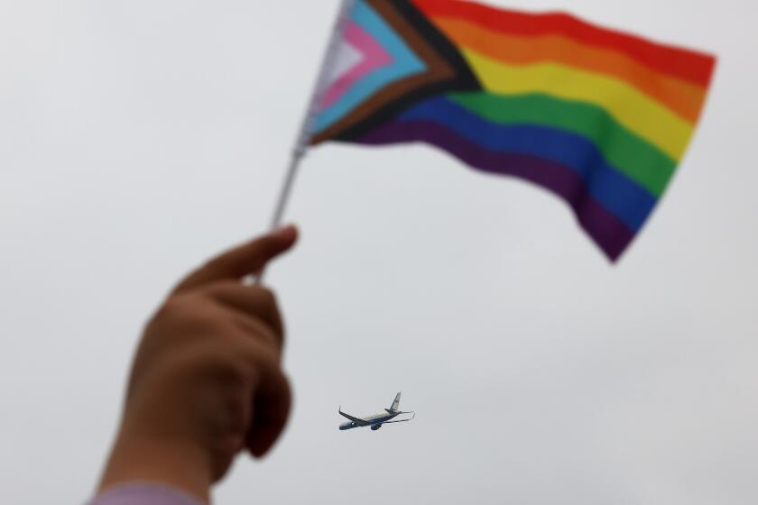 EL-SEGUNDO-CA-JUNE 1, 2024: A Pride flag waves as Vice President Kamala Harris departs Los Angeles International Airport on Air Force 2 for a political event in Seattle, Washington on June 1, 2024. (Christina House / Los Angeles Times)