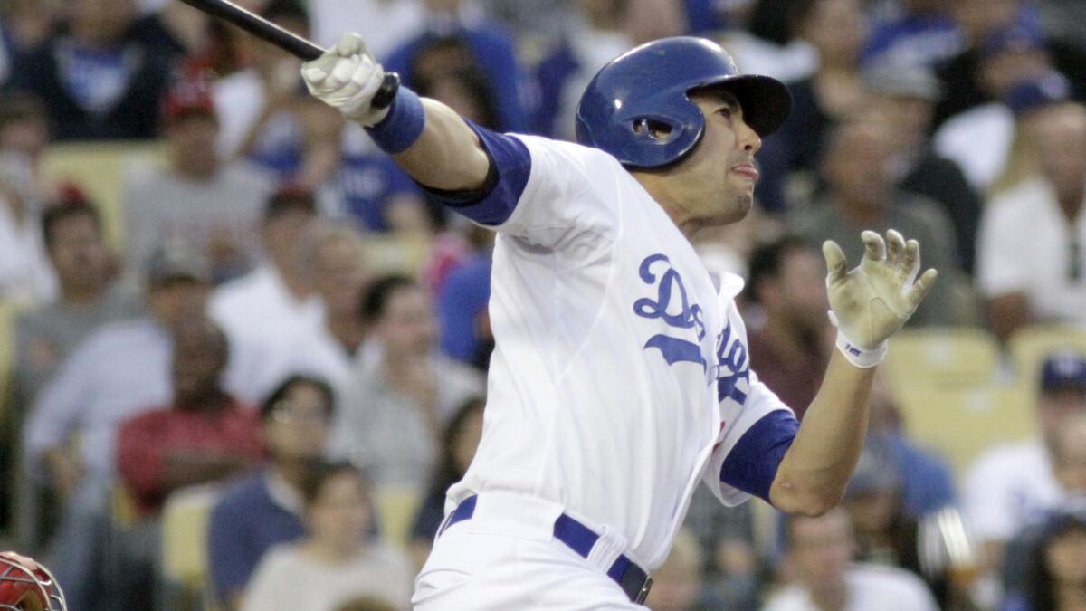 Dodgers center fielder Andre Ethier hits a solo home run in the second inning of the Dodgers' 6-3 win over the Cincinnati Reds on Tuesday.