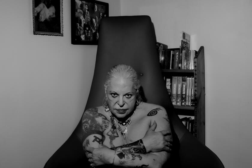 NEW YORK, NY. October 2, 2019--Portraits of iconic transgender artist and experimental musician Genesis P Orridge in their New York home. The artist, who is 69, has made as a lifelong project the manipulation of their body, and documented it for an upcoming show call Pandrogeny, which will open in Los Angeles in late Oct. Genesis, who coined the term "Industrial music" in 1975, has been diagnosed with stage 4 leukemia, is in very frail health and hooked in to an oxygen tank while fighting the disease. (Photo by Béatrice de Géa/For the Times) 467858