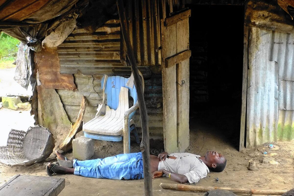 A man infected with the Ebola virus lies unconscious in his house outside Monrovia, Liberia. Health officials say blood transfusions could be used to help some patients.