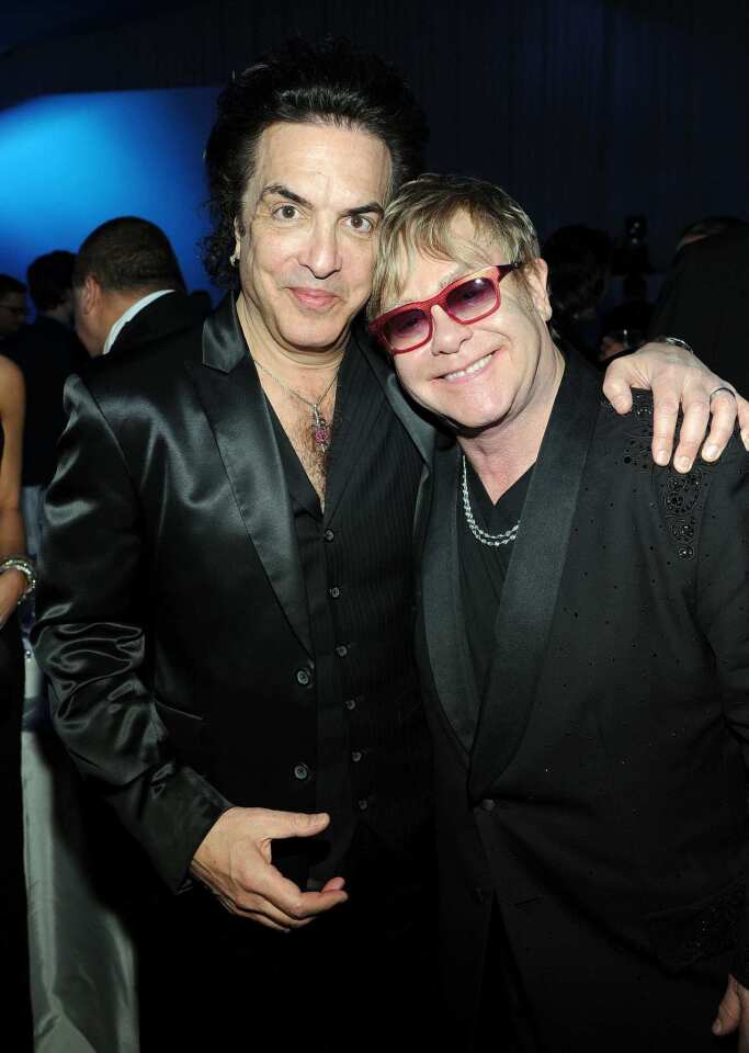 Musician Paul Stanley and Elton John inside the party.