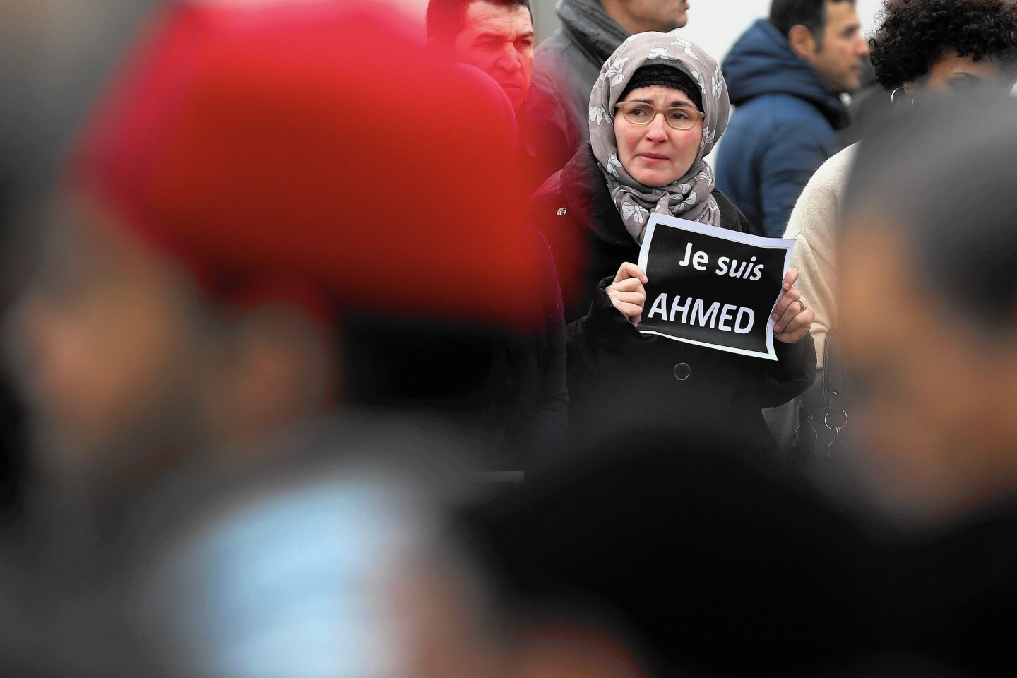 A mourner holds an "I am Ahmed" sign during the funeral of police Officer Ahmed Merabet at a mosque in Bobigny, France. Merabet was killed by terrorists during the attack on Charlie Hebdo magazine.