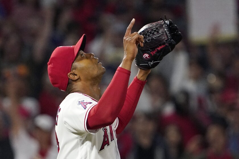 Angels relief pitcher Raisel Iglesias gestures after a win over Boston on June 9.