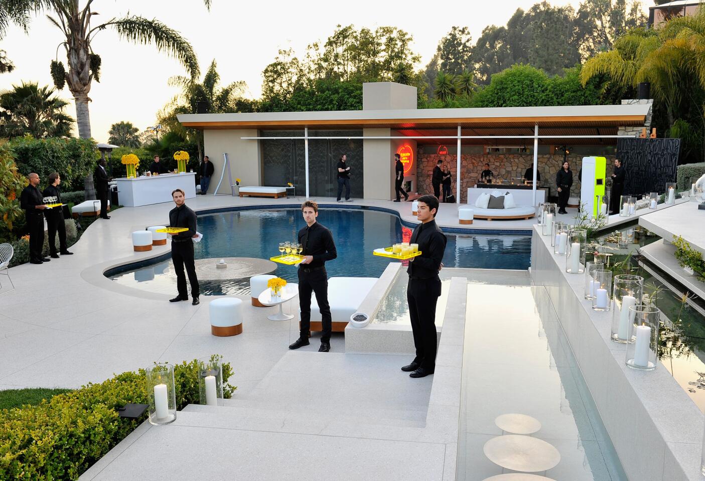 Art collector Eugenio Lopez Alonso opened his Mid-Century Modern home in Beverly Hills to the Jimmy Choo launch, where partygoers lounged poolside with drinks.