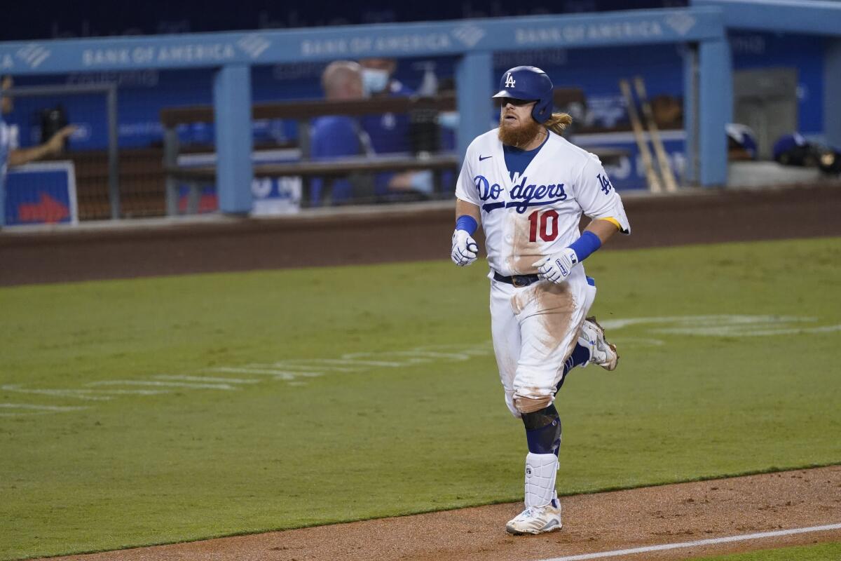 The Dodgers' Justin Turner rounds the bases after homering during the third inning Friday.