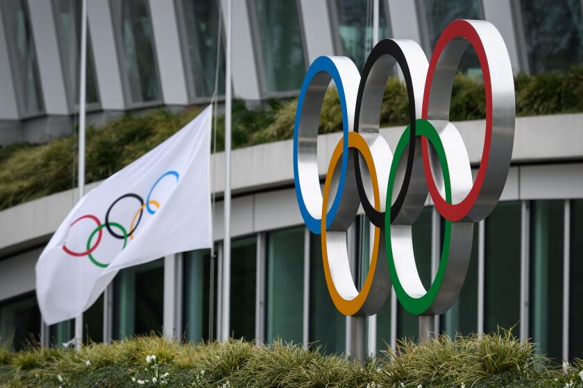 The Olympic Rings are pictured in front of the headquarters of the International Olympic Committee (IOC) in Lausanne on March 22, 2020, as doubts increase over whether Tokyo can safely host the summer Games amid the spread of the COVID-19. - The global sporting calendar has been swept away by the coronavirus pandemic but the International Olympic Committee has insisted the Tokyo Games will go ahead in four months despite growing calls for a postponement. (Photo by FABRICE COFFRINI / AFP) (Photo by FABRICE COFFRINI/AFP via Getty Images)