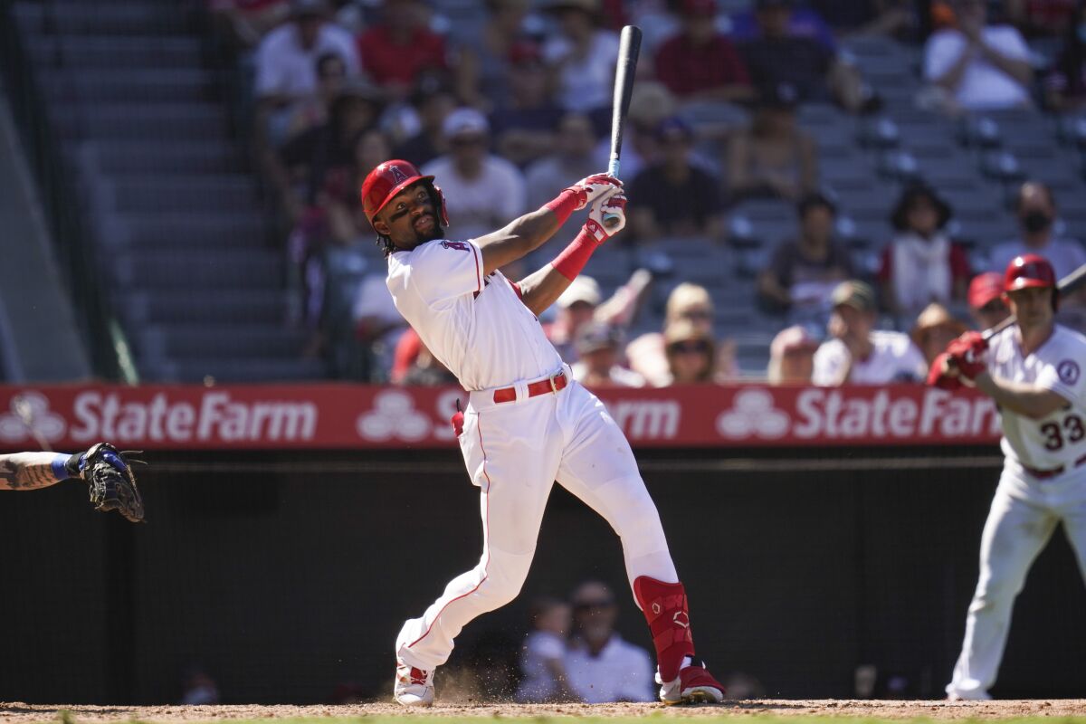 Jo Adell hits a home run for the Angels during the sixth inning Sunday.