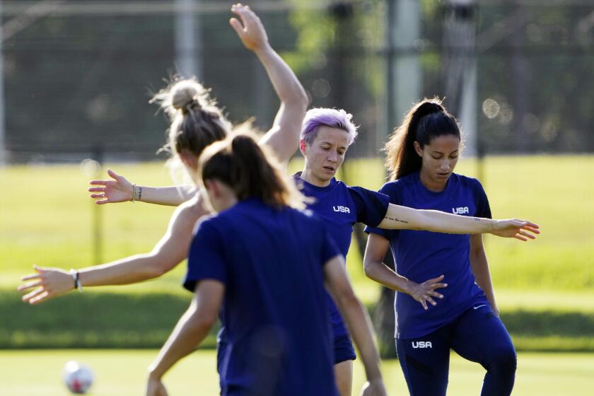 Megan Rapinoe, second right, and her teammates warm up at a training session of United States women's soccer team at Prince Takamado Memorial JFA YUME Field Saturday, July 17, 2021, in Chiba, near Tokyo. (AP Photo/Eugene Hoshiko)
