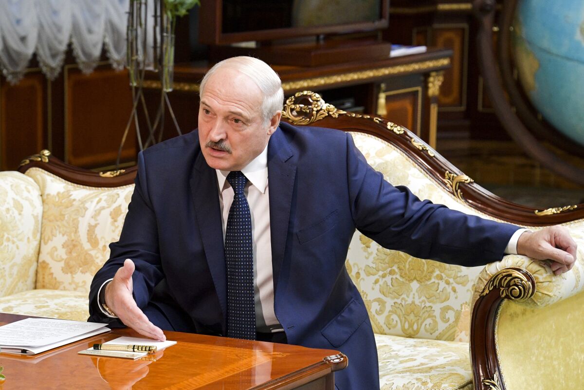 Belarusian President Alexander Lukashenko gestures while speaking to Russian Prime Minister Mikhail Mishustin, during their talks in Minsk, Belarus, Thursday, Sept. 3, 2020. On Thursday, Russia's Prime Minister Mikhail Mishustin traveled to the Belarusian capital to discuss conditions for Belarus to refinance a Russian loan. (Alexander Astafyev, Sputnik, Kremlin Pool Photo via AP)