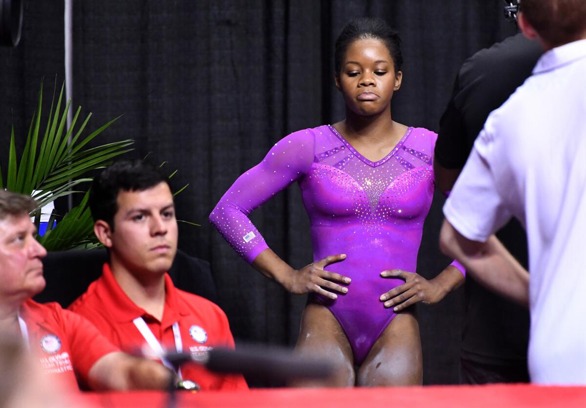 U.S. gymnast Gabriel Douglas reacts after falling off the beam uring the first day of the U.S. women's gymnastics Olympic trials in San Jose.