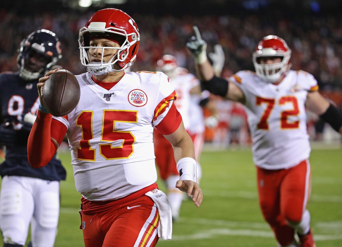 Chiefs quarterback Patrick Mahomes runs for a 12-yard touchdown in his team's 26-3 rout of the Bears on Dec. 22, 2019.