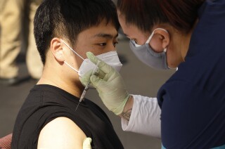 Confidence grows that COVID-19 vaccines hold their own
against variants 2 LOS ANGELES, CA - APRIL 20: Changhun Sung, 27, receives the Pfizer Covid-19 vaccination from student registered nurse Stephanie Koen as at a new, walk-up mobile COVID-19 clinic launched today to provide the Pfizer COVID-19 vaccine to underserved communities in Los Angeles. The walk-up clinic was presented by Councilmember Mark Ridley-Thomas in partnership with CHA Hollywood Presbyterian Medical Center (CHA HPMC) and the Southern California Eye Institute (SCEI). The Mobile Vaccine Clinic at 1819 S. Western Avenue will be open every Tuesday starting April 20 through May 25 providing free vaccines to community members who are eligible per LA County Department of Public Health (LAC DPH) vaccine distribution guidelines as they partnered with Charles R. Drew University of Medicine and Science to provide student volunteers for on-site registration allowing for walk-up appointments for community members and further ensuring vaccine access in our hardest-hit communities. Los Angeles on Tuesday, April 20, 2021 in Los Angeles, CA. (Al Seib / Los Angeles Times).