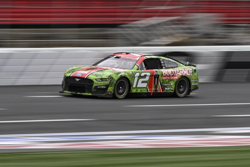 Ryan Blaney (12) competes during a NASCAR Cup Series auto race at Charlotte Motor Speedway.