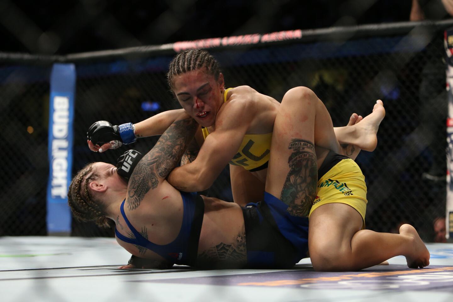 Jessica Andrade, top, defeated Joanne Calderwood by submission Sept. 10 at UFC 203 in Cleveland.