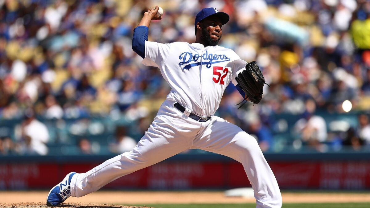 Pedro Baez delivers a pitch against the Cincinnati Reds on April 17. Baez's continued evolution as a pitcher has made him a reliable reliever for the Dodgers.