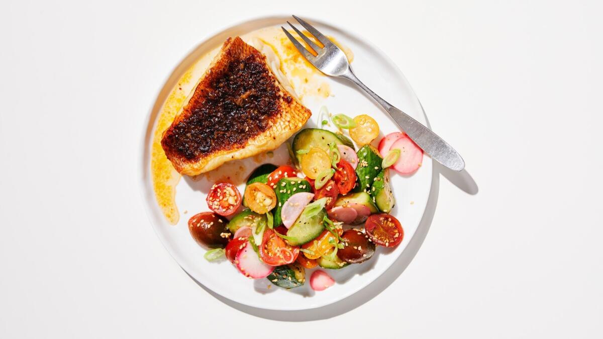 A cold, crunchy salad of cucumbers and tomatoes cools off spicy blackened red snapper fillets. Food styled by Ben Mims, with Julie Giuffrida at Proplink Tabletop Studio in downtown Los Angeles.